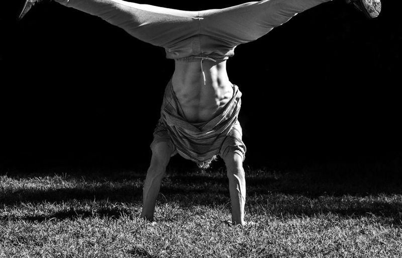 Athlete in mid-motion during a bodyweight exercise.